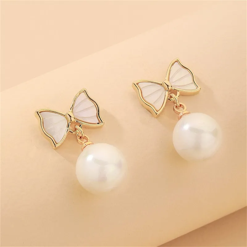 White Shell & Pearl Goldtone Bow Round Drop Earrings made by Zulily