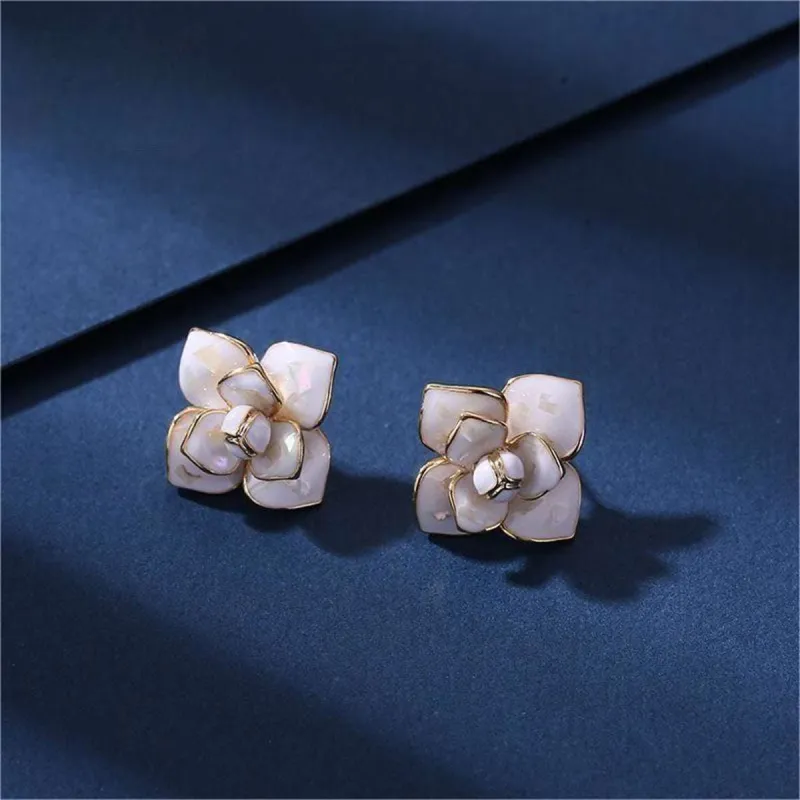 White Enamel & Goldtone Camellia Stud Earrings made by Zulily
