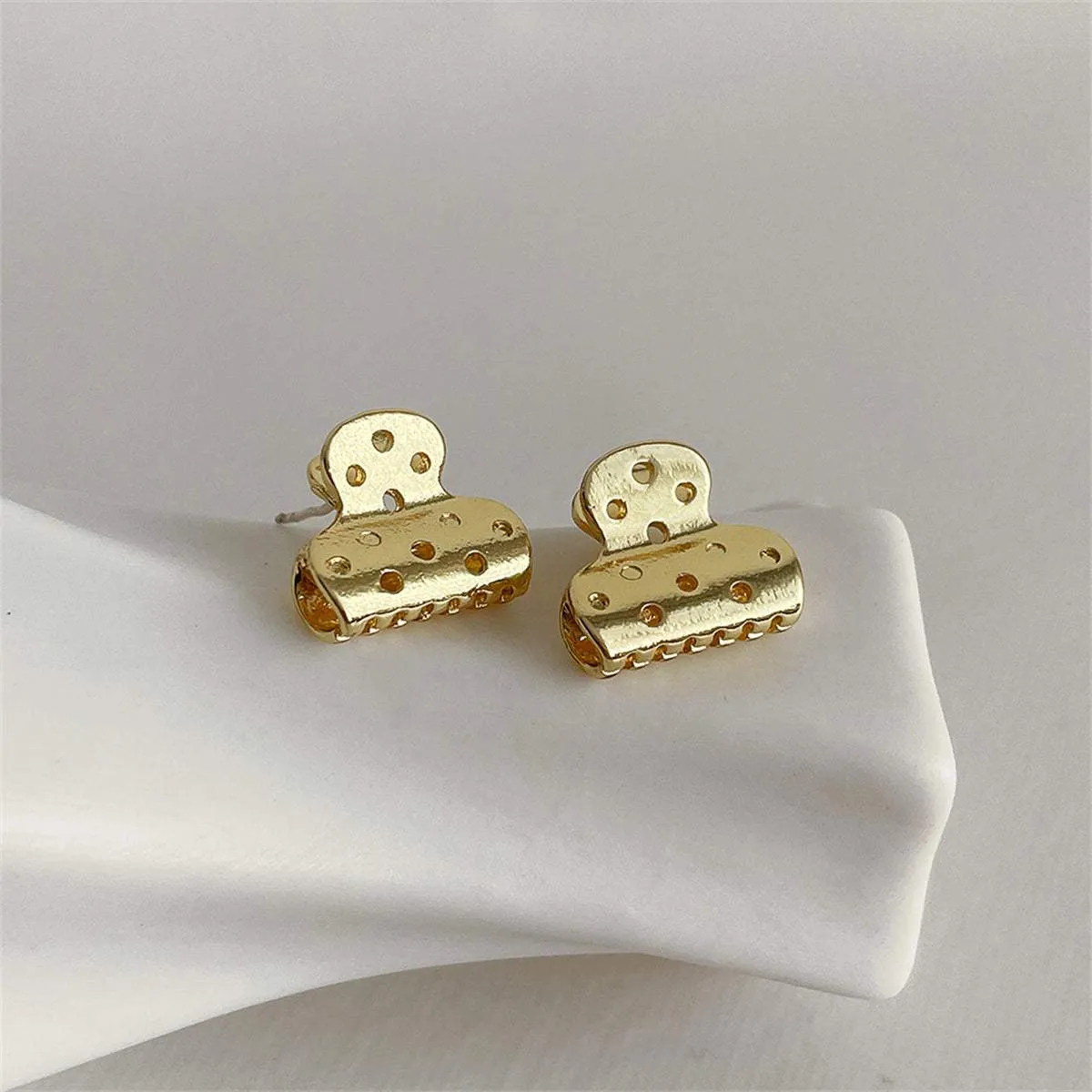 Goldtone File Clip Stud Earrings sold by Zulily product image thumbnail 2