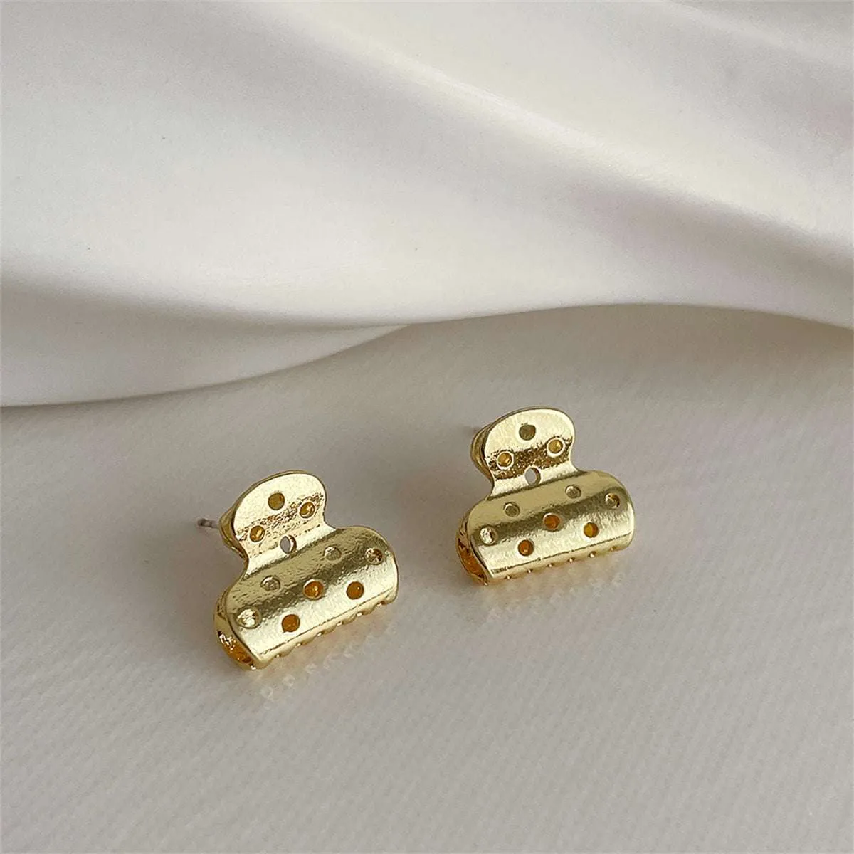 Goldtone File Clip Stud Earrings sold by Zulily