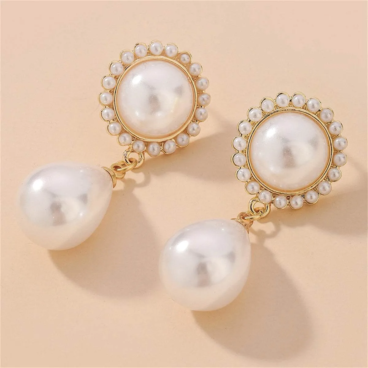 White Pearl & Goldtone Teardrop Earrings sold by Zulily