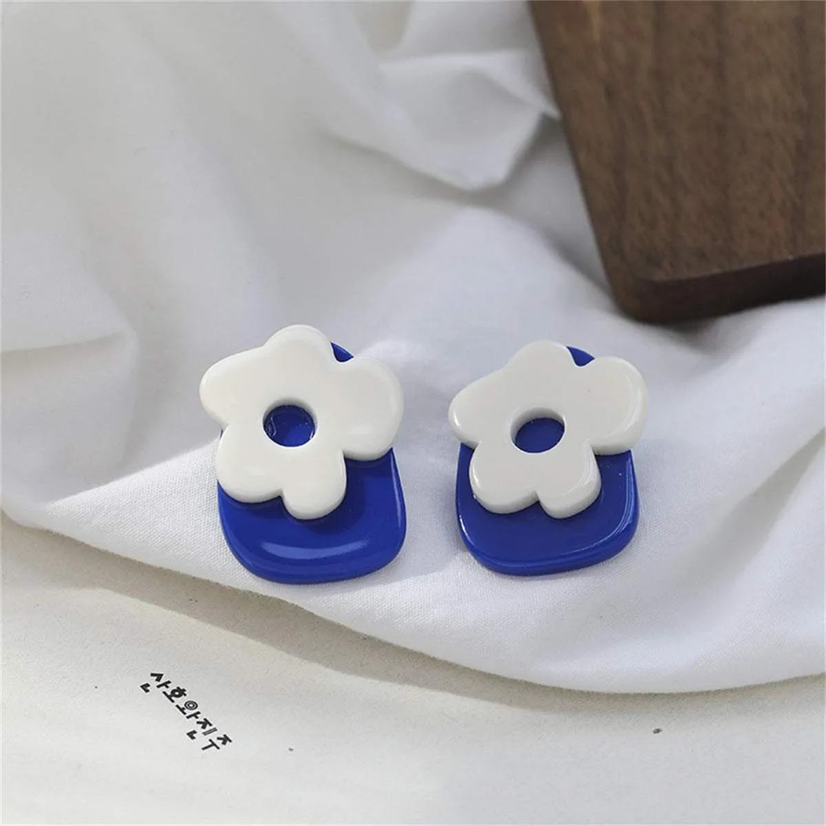Blue & White Flower Stud Earrings sold by Zulily