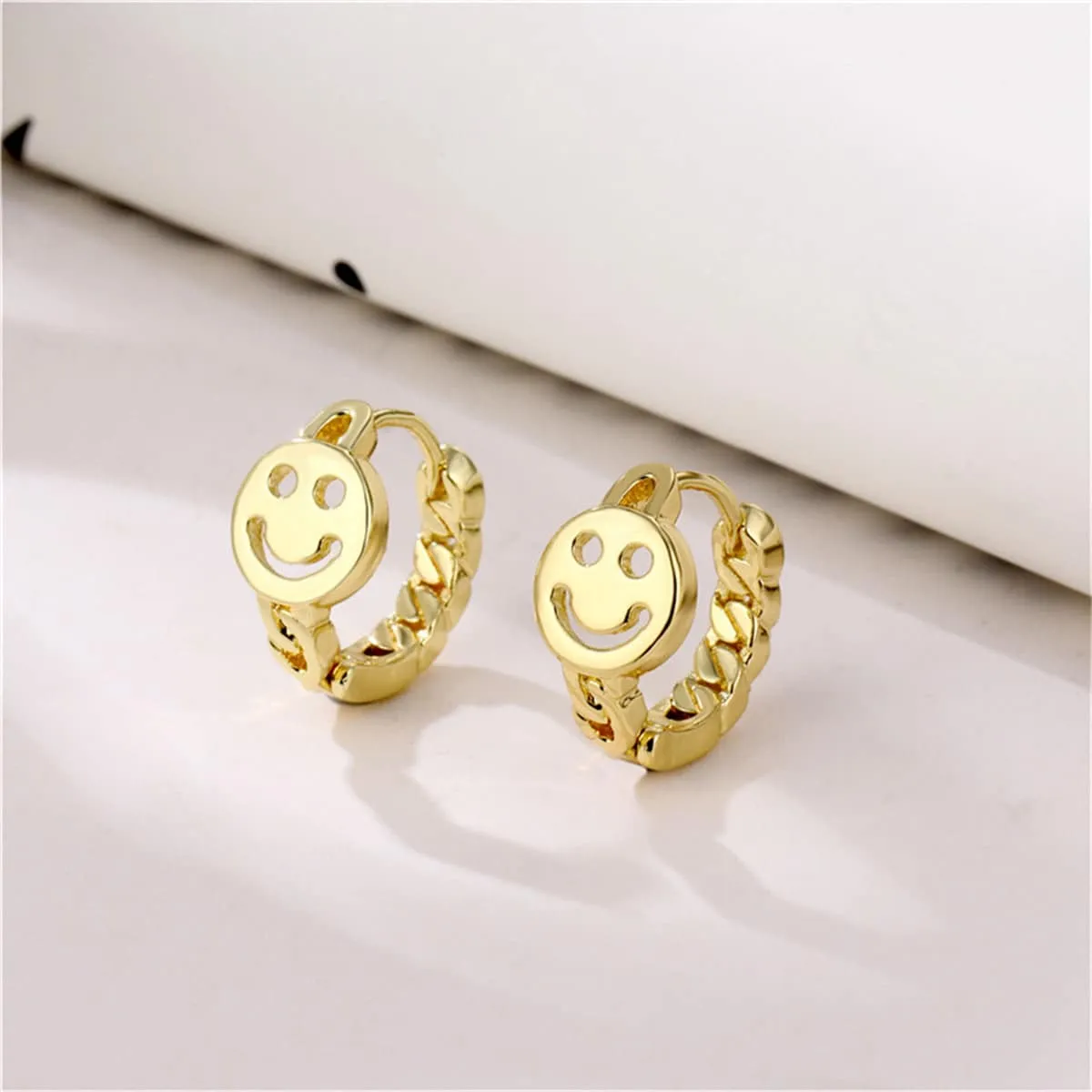 Goldtone Openwork Smile Huggie Earrings sold by Zulily product image thumbnail 2