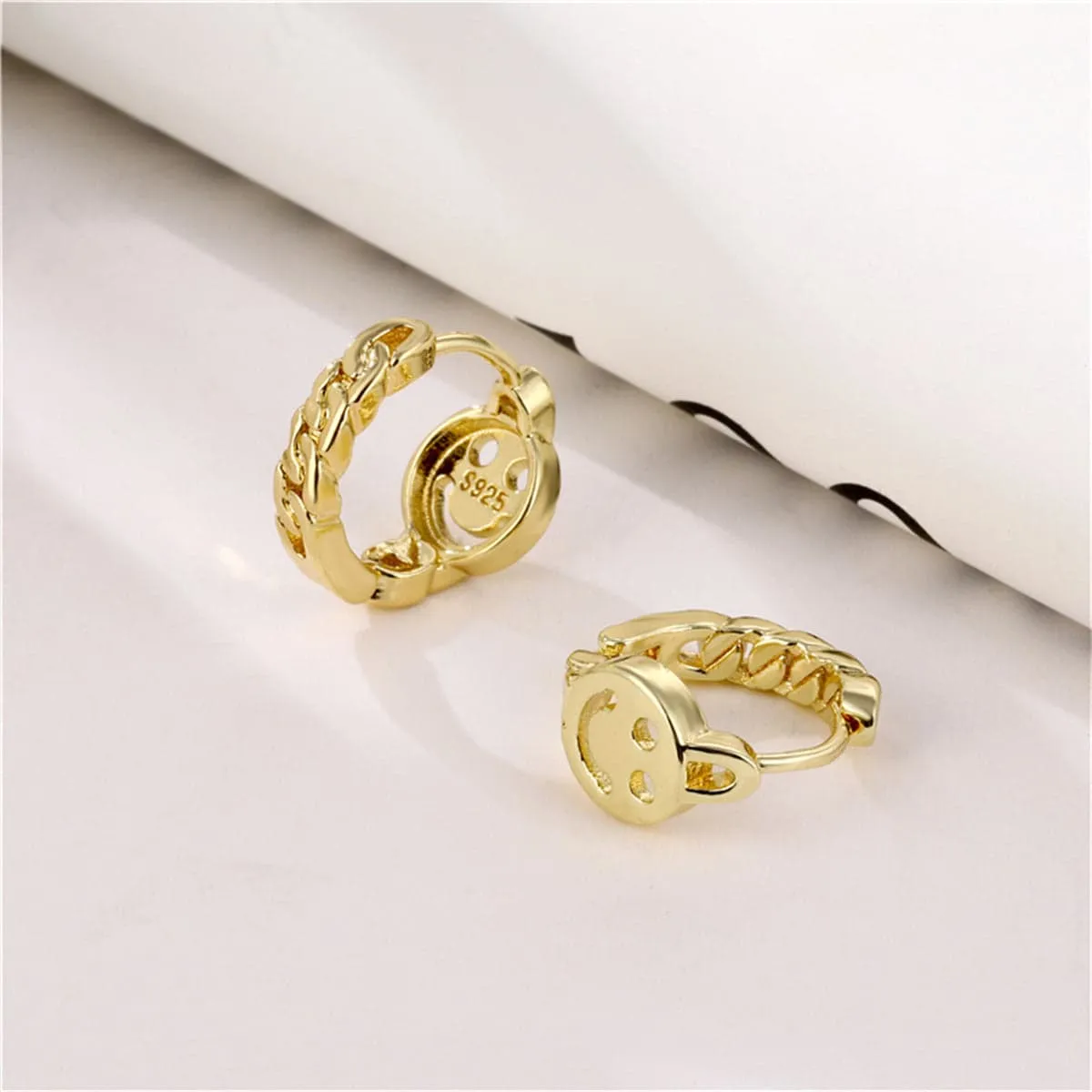 Goldtone Openwork Smile Huggie Earrings sold by Zulily product image thumbnail 3