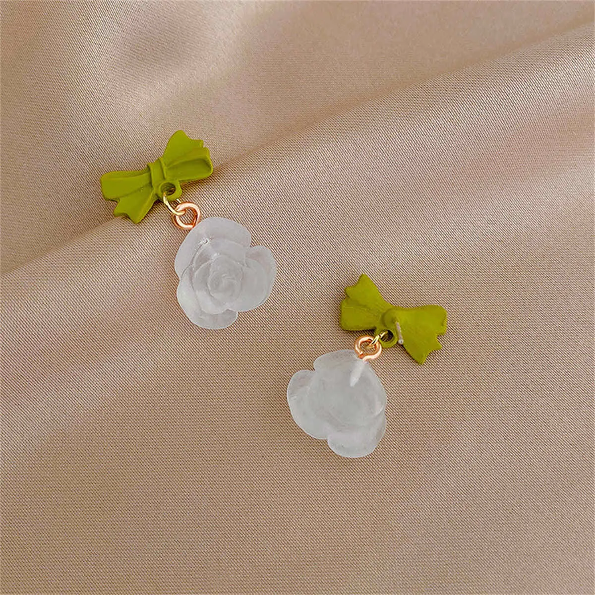 Green & Translucent Bow & Rose Drop Earrings sold by Zulily