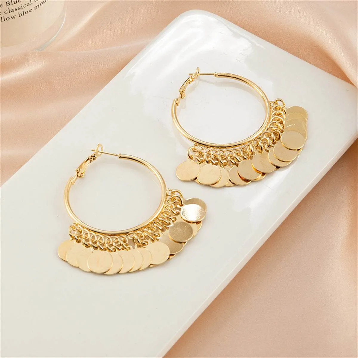 Goldtone Disc Tassel Huggie Earrings sold by Zulily product image thumbnail 3