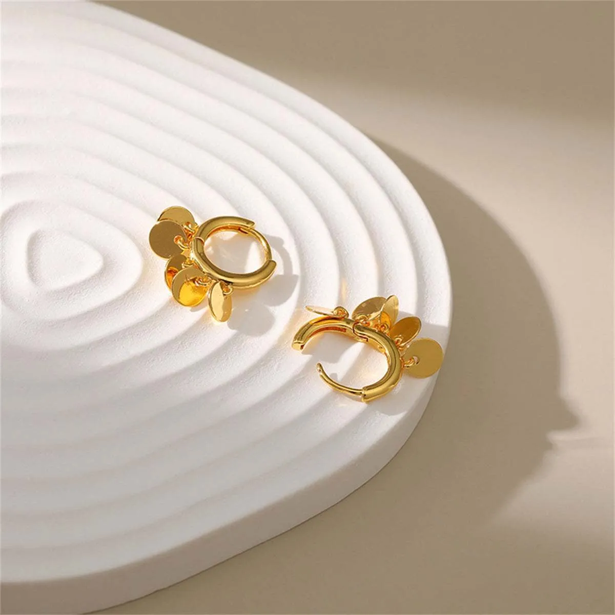 Goldtone Disc Tassel Huggie Earrings sold by Zulily product image thumbnail 4