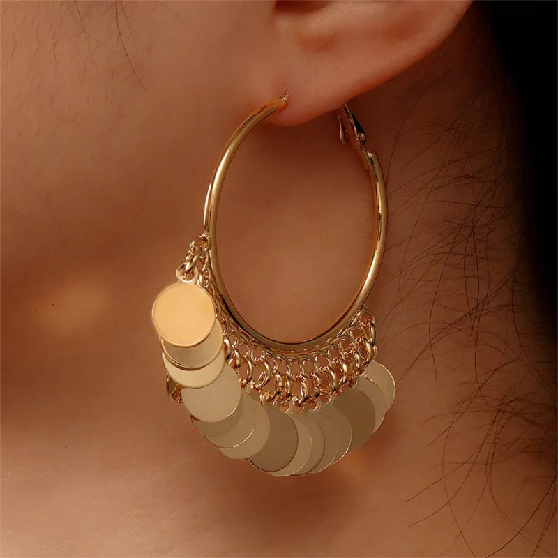 Goldtone Disc Tassel Huggie Earrings made by Zulily