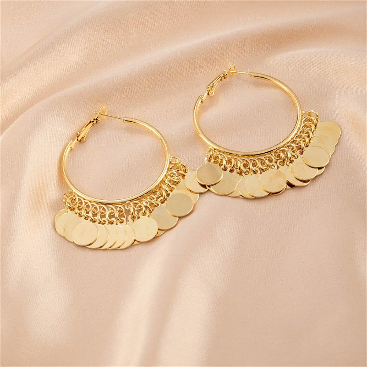 Goldtone Disc Tassel Huggie Earrings sold by Zulily product image thumbnail 2