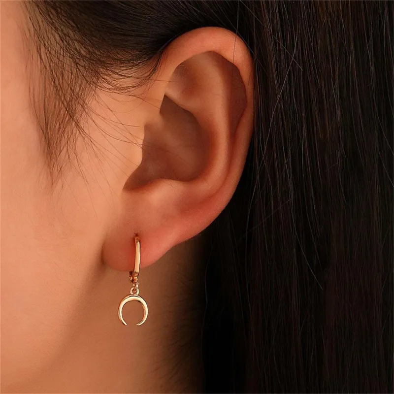 Goldtone Crescent Moon Huggie Earrings made by Zulily