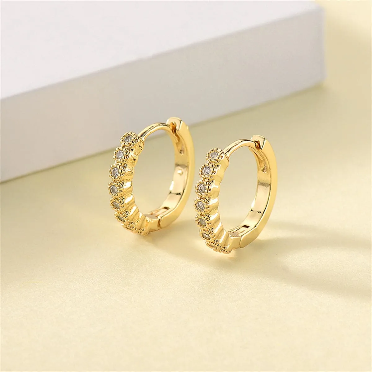 Cubic Zirconia & Goldtone Bezel Huggie Earrings sold by Zulily