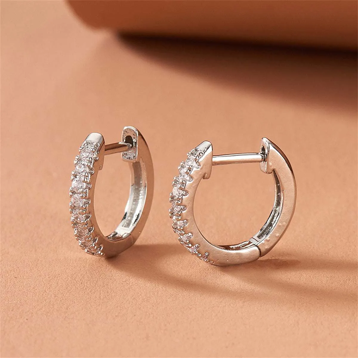 Cubic Zirconia & Silvertone Huggie Earring sold by Zulily product image thumbnail 3
