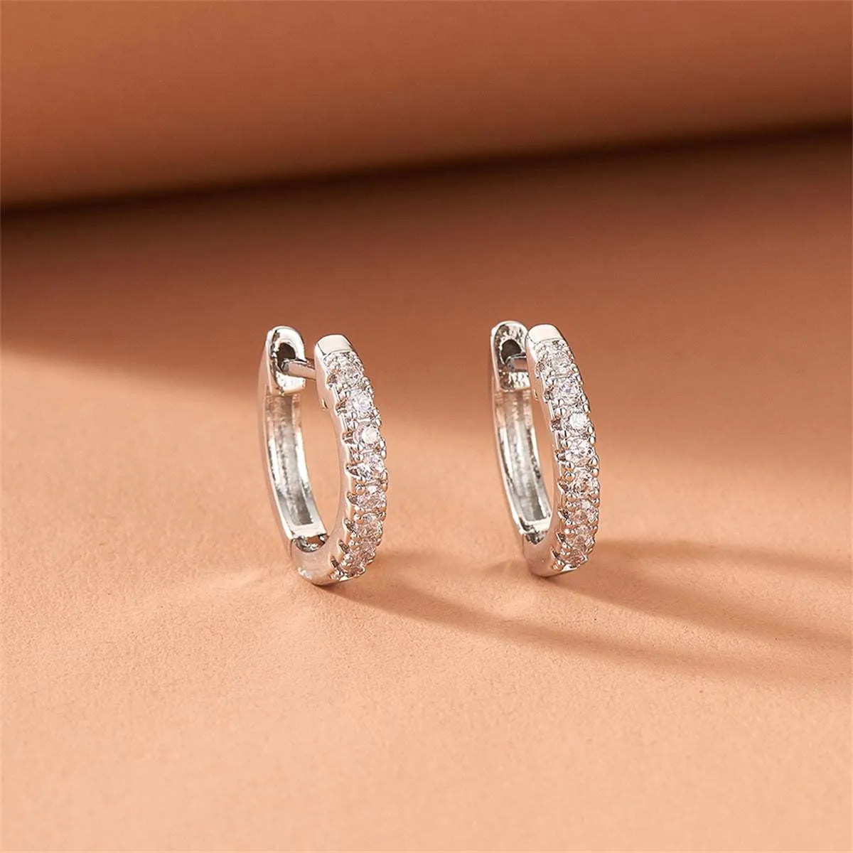 Cubic Zirconia & Silvertone Huggie Earring sold by Zulily product image thumbnail 2