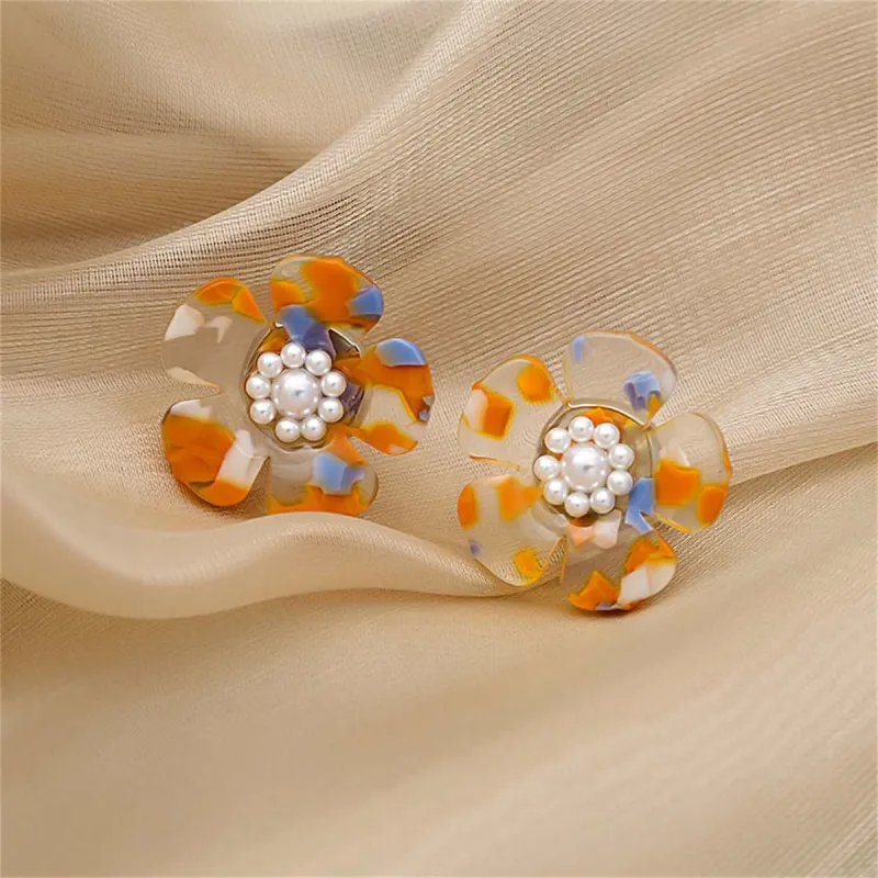 White & Silvertone Flower Stud Earrings made by Zulily