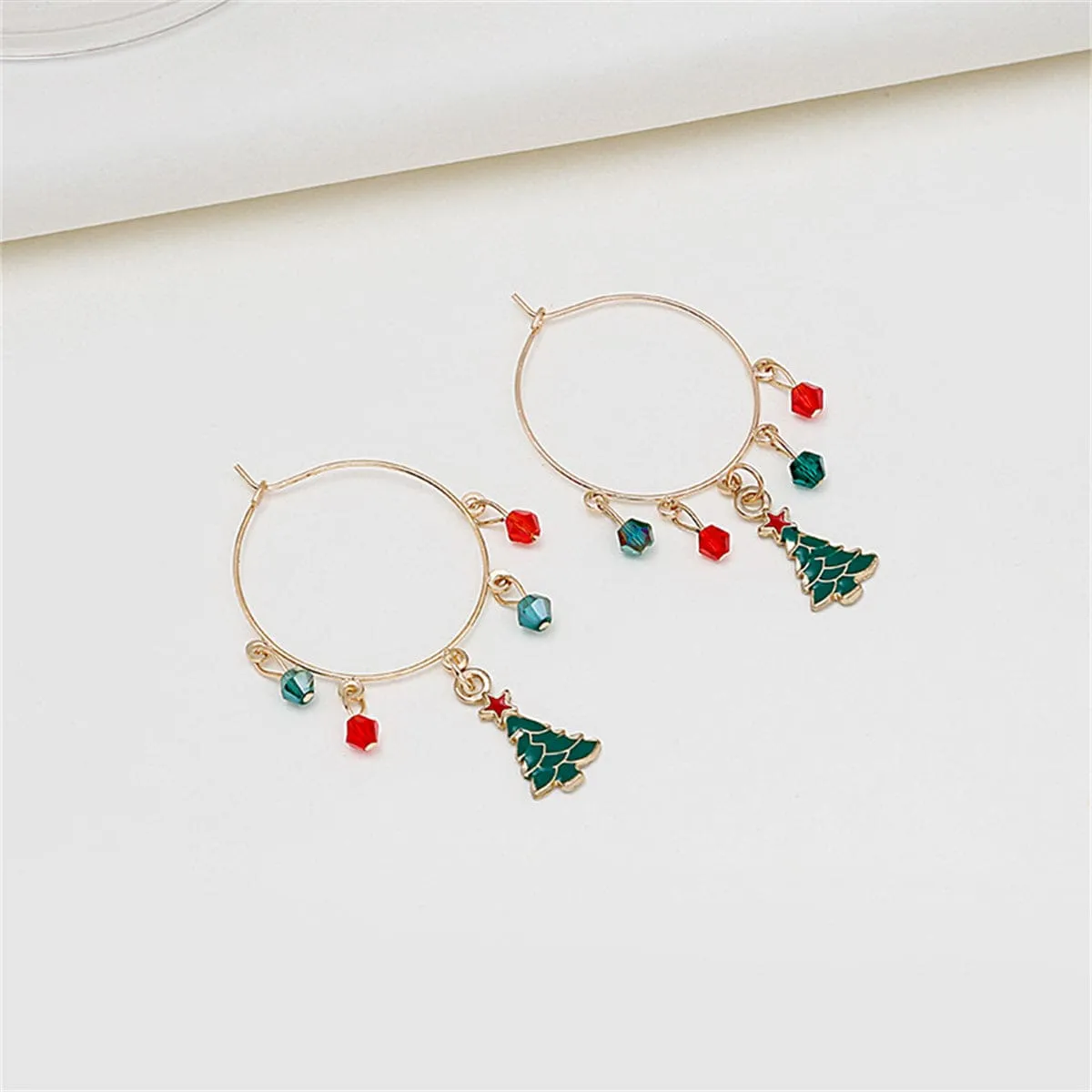 Red Acrylic & Enamel Goldtone Christmas Tree Huggie Earrings sold by Zulily