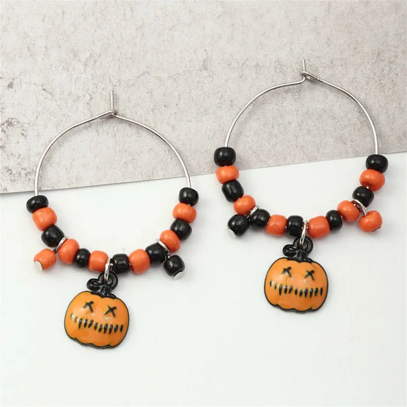 Orange Howlite & Silvertone Pumpkin Huggie Earrings made by Zulily