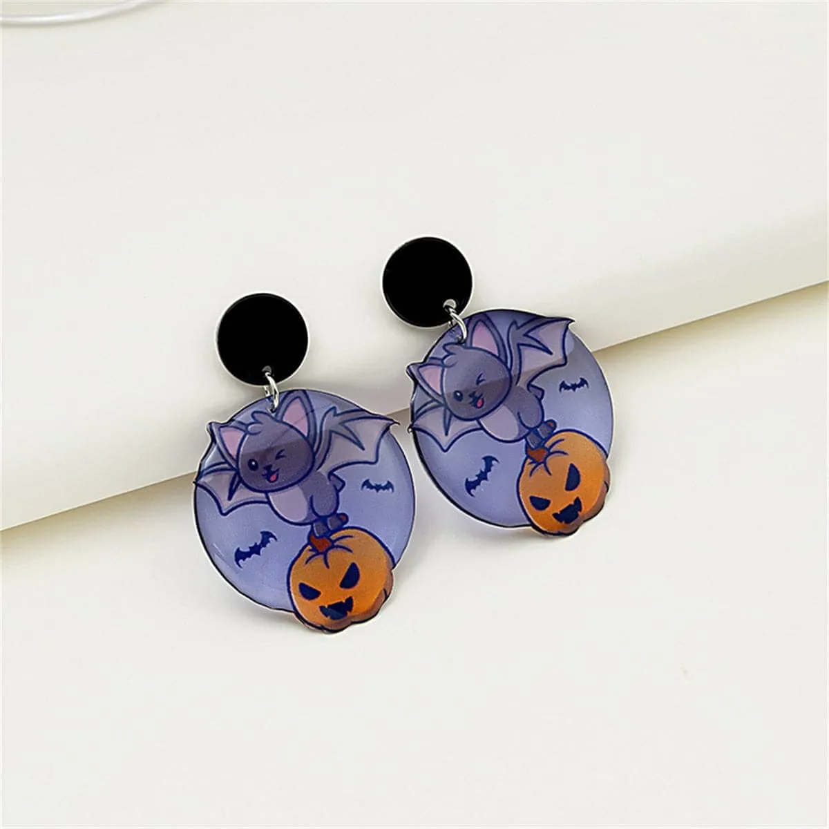 Purple & Black Bat Pumpkin Drop Earrings sold by Zulily