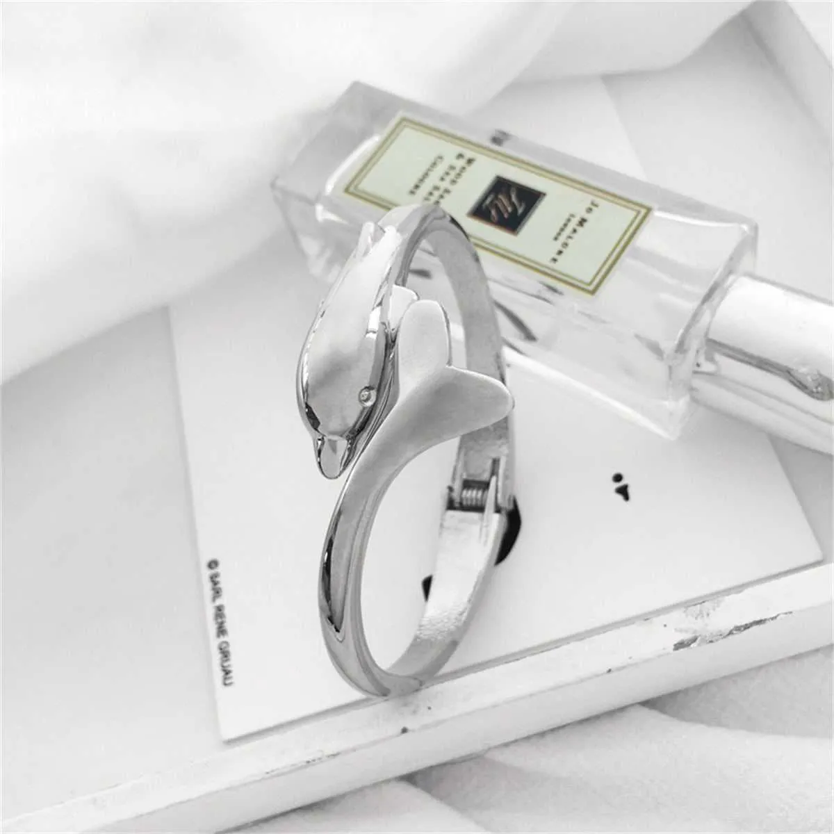 Silvertone Dolphin Hinged Bangle sold by Zulily product image thumbnail 2