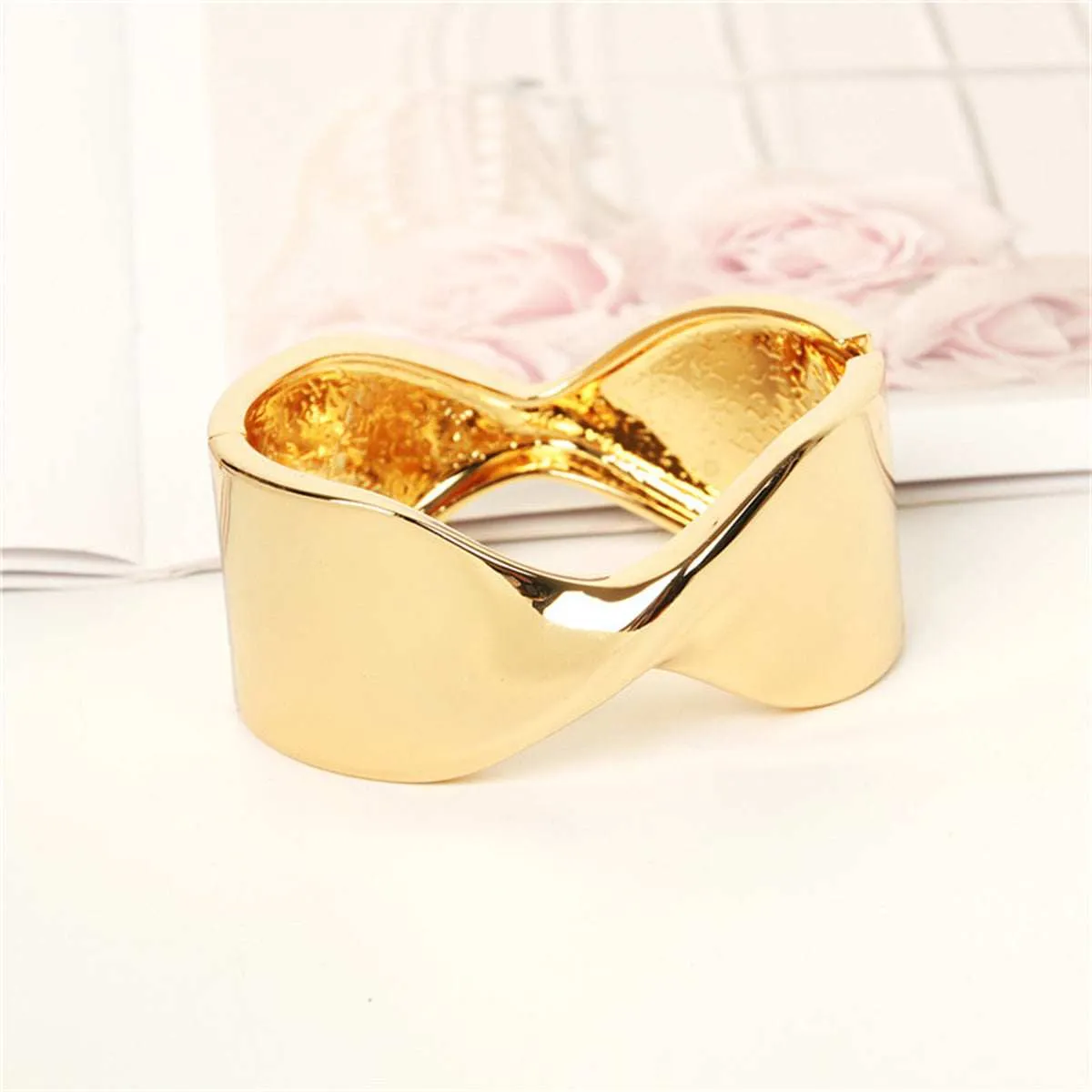 Goldtone Twisted Bangle sold by Zulily product image thumbnail 2