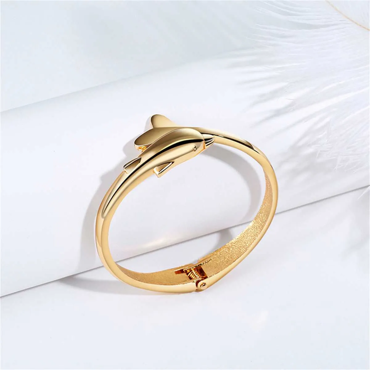 Goldtone Dolphin Hinged Bangle sold by Zulily product image thumbnail 3