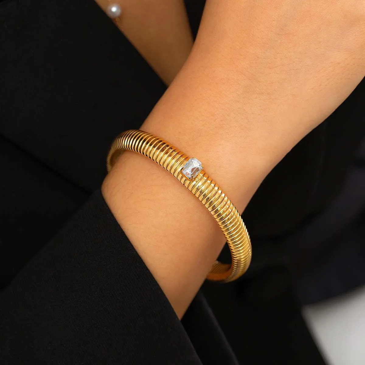 Clear Crystal & Goldtone Herringbone Bangle sold by Zulily