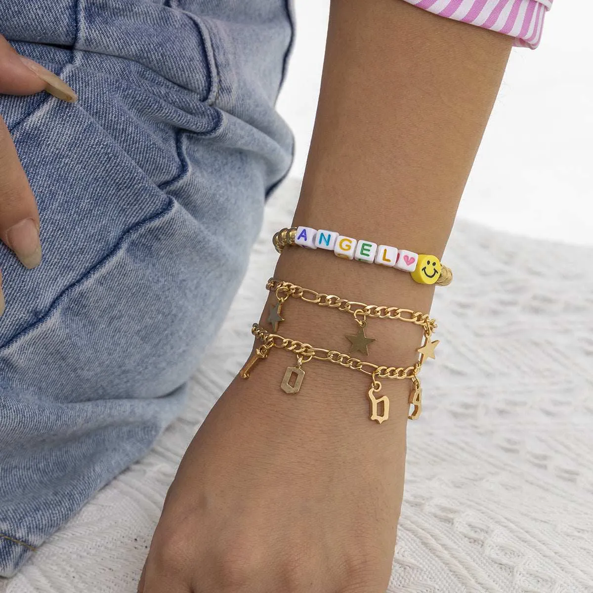 White Acrylic & Goldtone 'Love Angel' Beaded Stretch Bracelet Set sold by Zulily