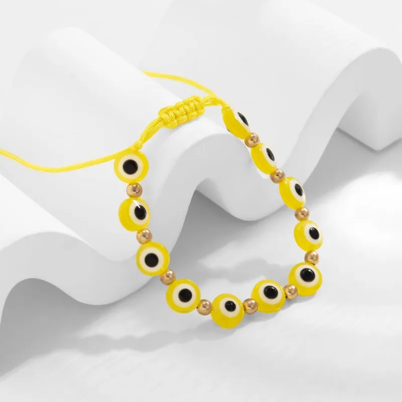 Yellow Polyster & Goldtone Eye Beaded Adjustable Bracelet made by Zulily