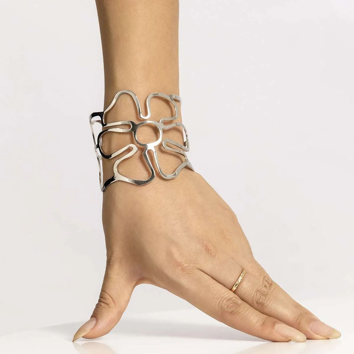 Silvertone Openwork Flower Cuff sold by Zulily