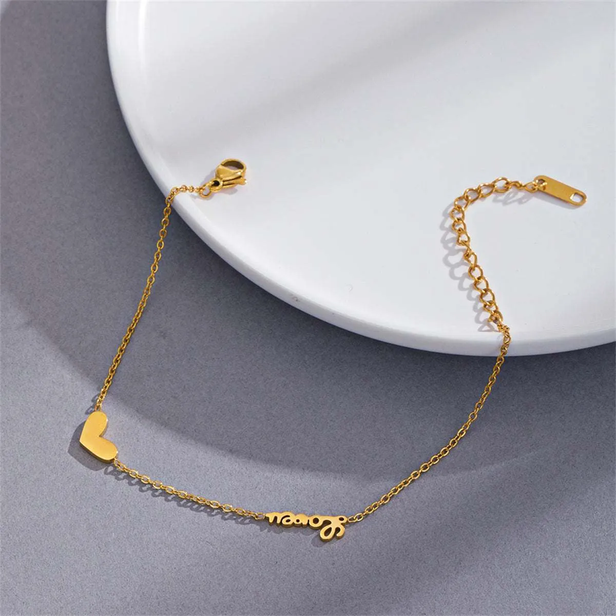 Goldtone Heart 'Love' Bracelet sold by Zulily