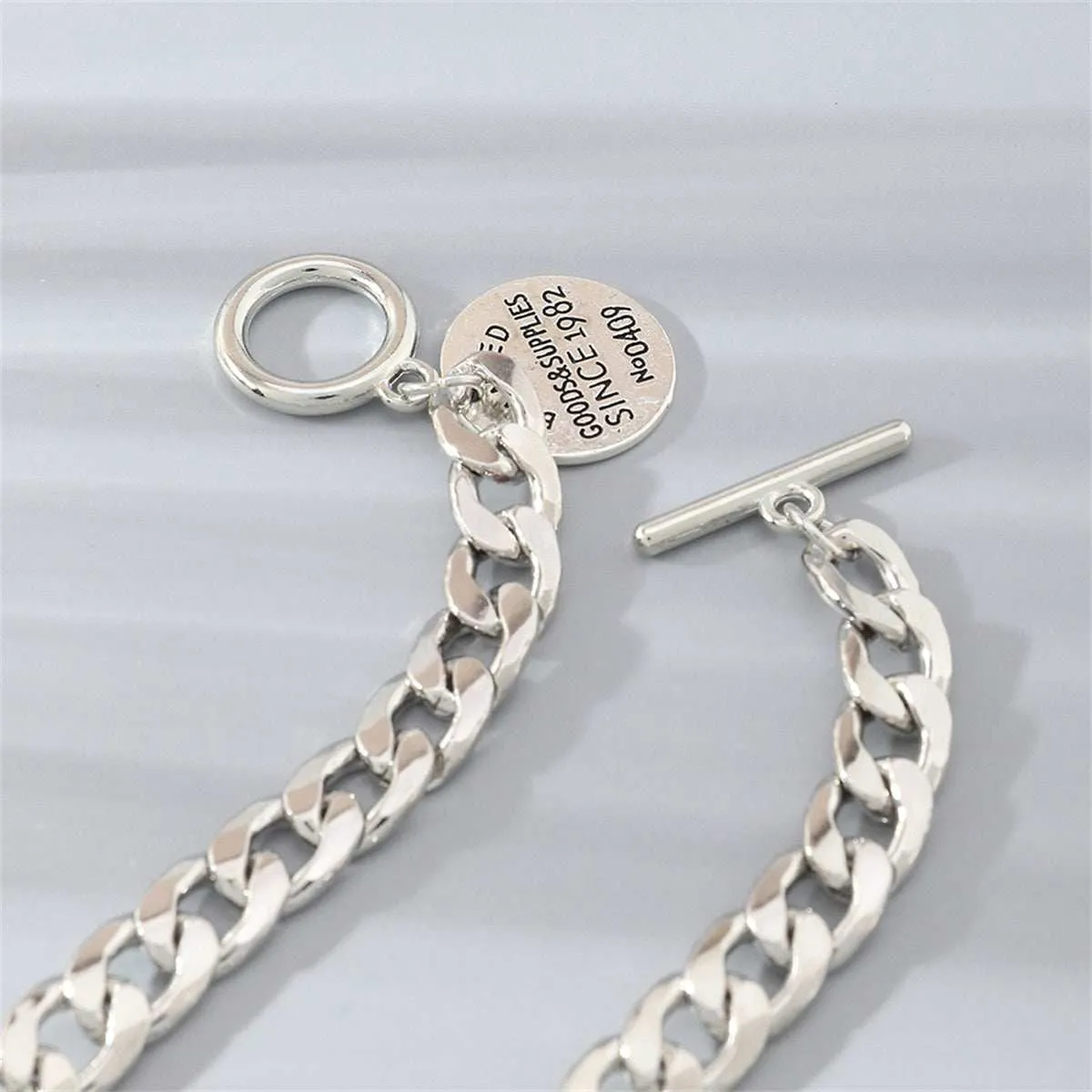Silvertone 'Goods & Supplies' Curb Chain Toggle Bracelet sold by Zulily product image thumbnail 3