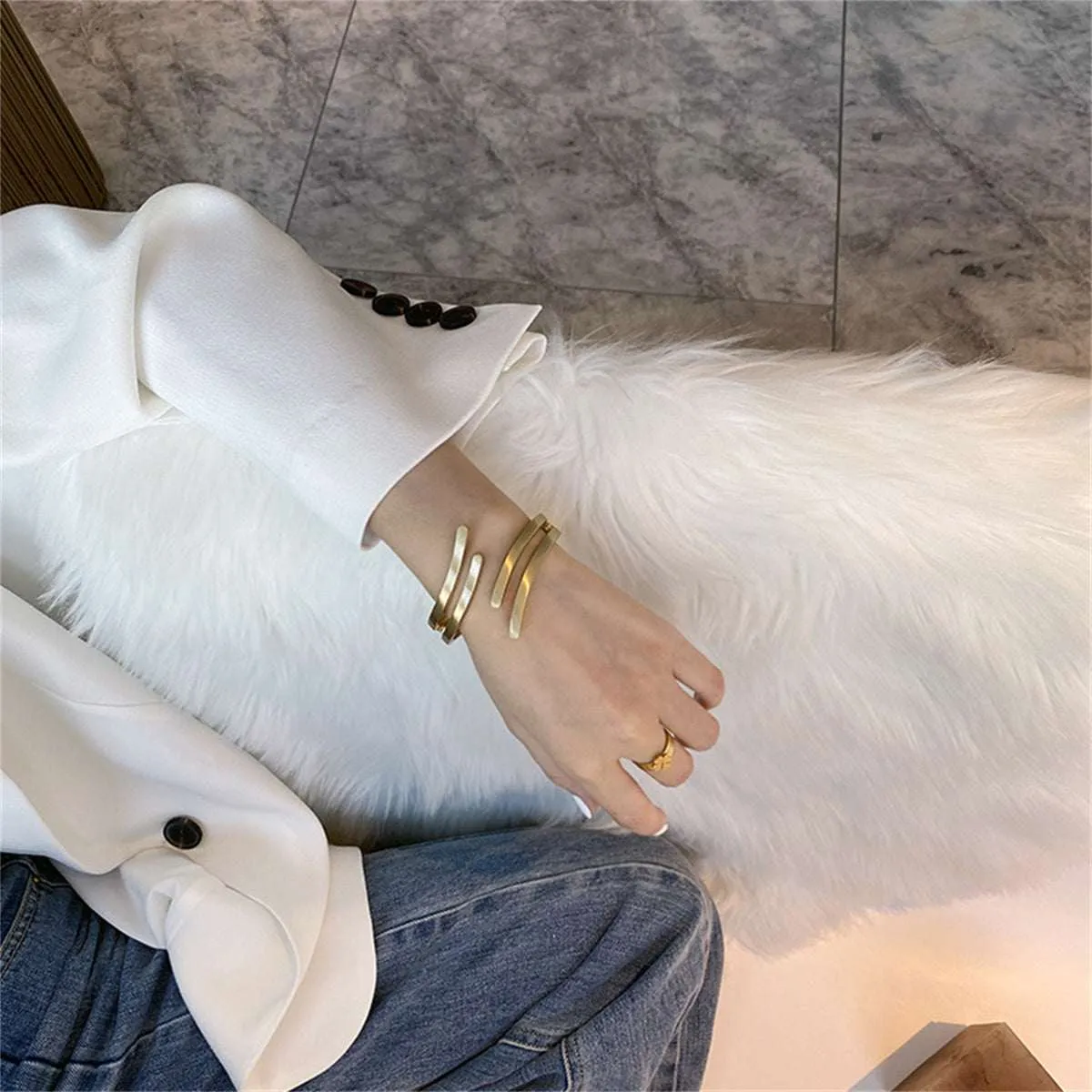 Goldtone Wing Open Bypass Coil Bracelet sold by Zulily product image thumbnail 2