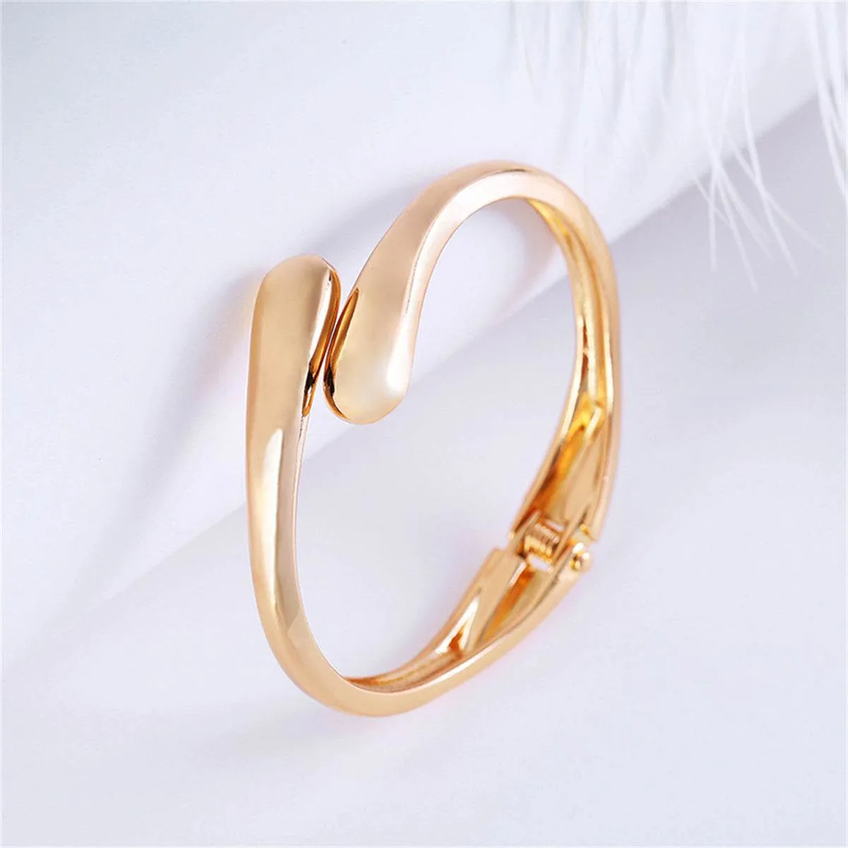 Goldtone Drop Bypass Hinge Bangle sold by Zulily product image thumbnail 2