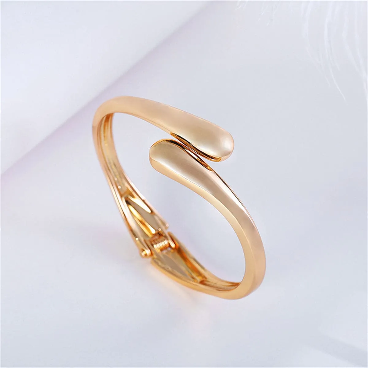 Goldtone Drop Bypass Hinge Bangle sold by Zulily product image thumbnail 3