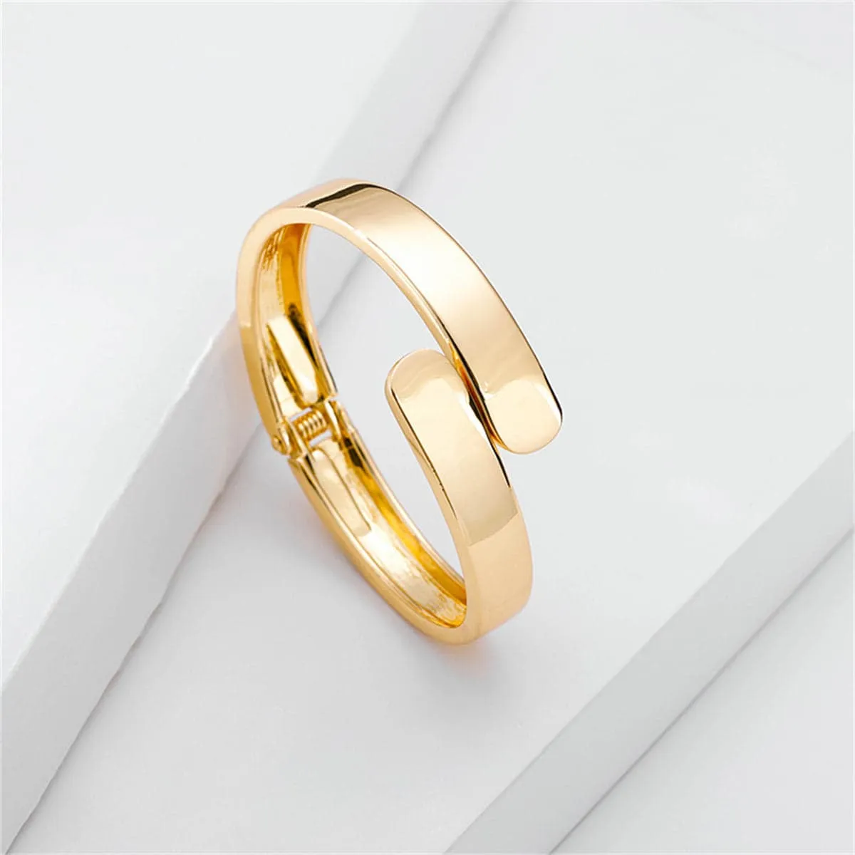 Goldtone Bypass Hinge Bangle sold by Zulily product image thumbnail 3
