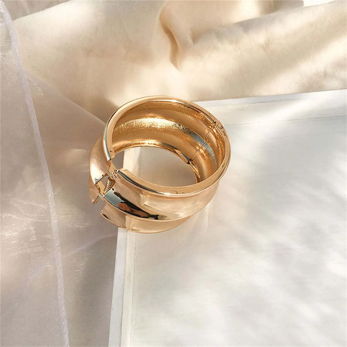 Goldtone Drum Hinge Bangle sold by Zulily product image thumbnail 2
