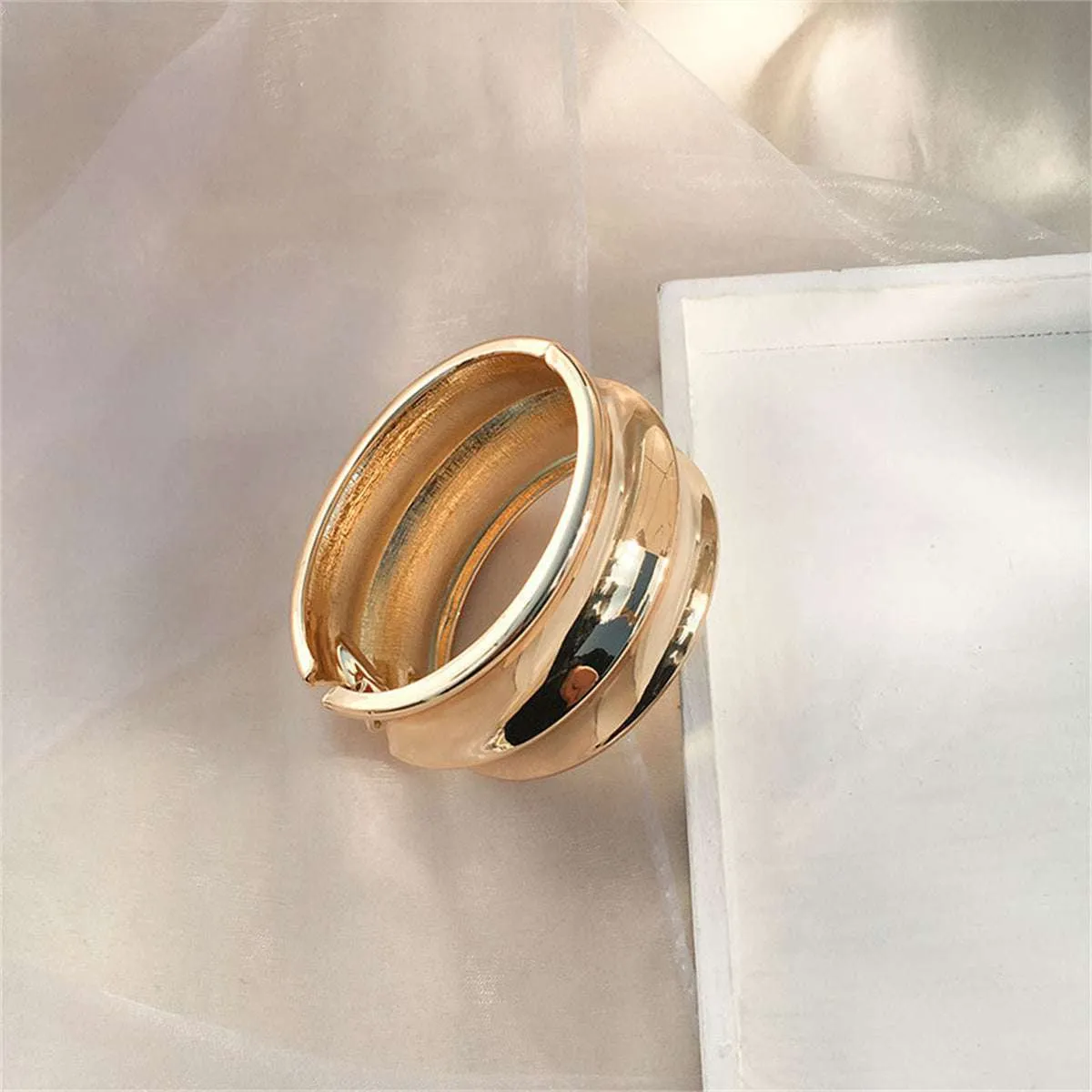 Goldtone Drum Hinge Bangle sold by Zulily product image thumbnail 3