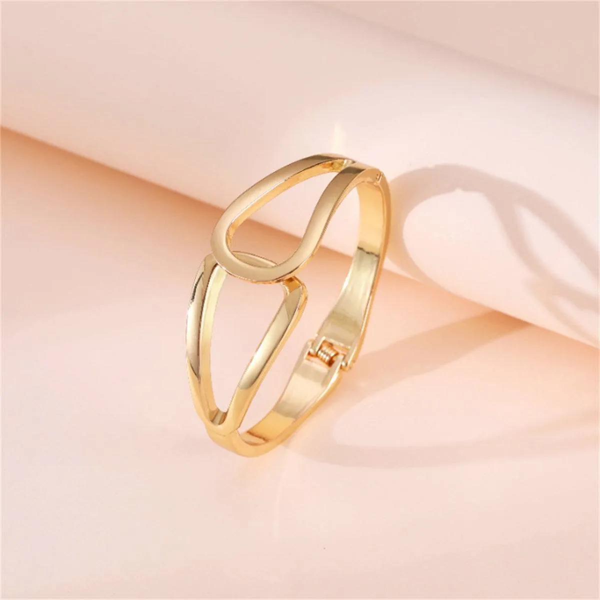 Goldtone Openwork Drop End Bangle sold by Zulily product image thumbnail 3