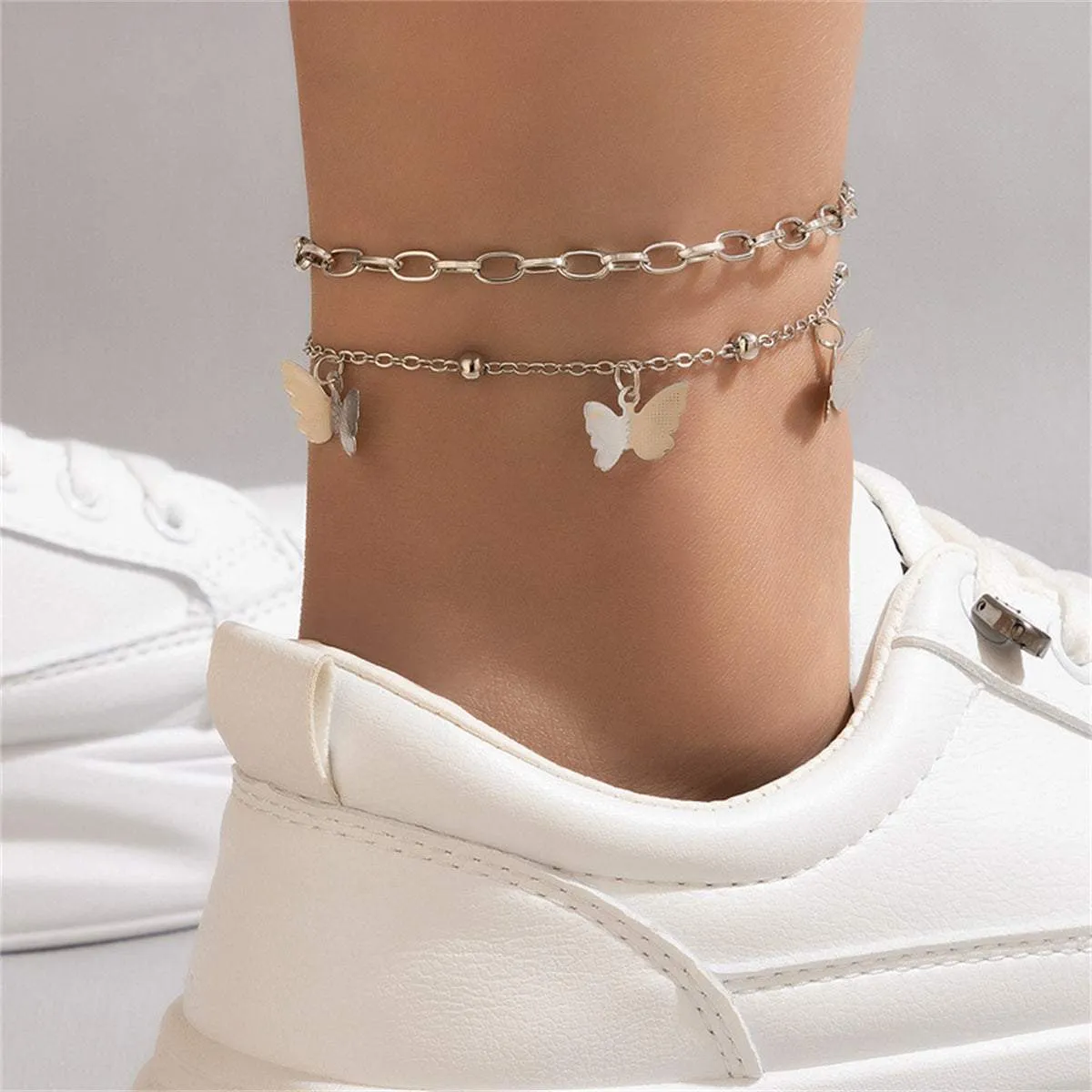 Silvertone Butterfly Station Chain Anklet Set sold by Zulily