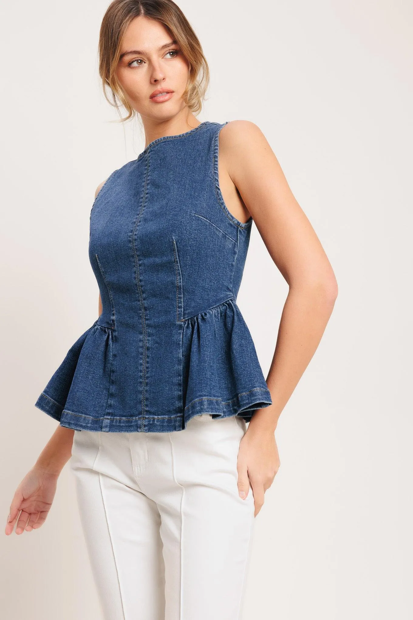 Modern Flounce Denim Top sold by Zulily