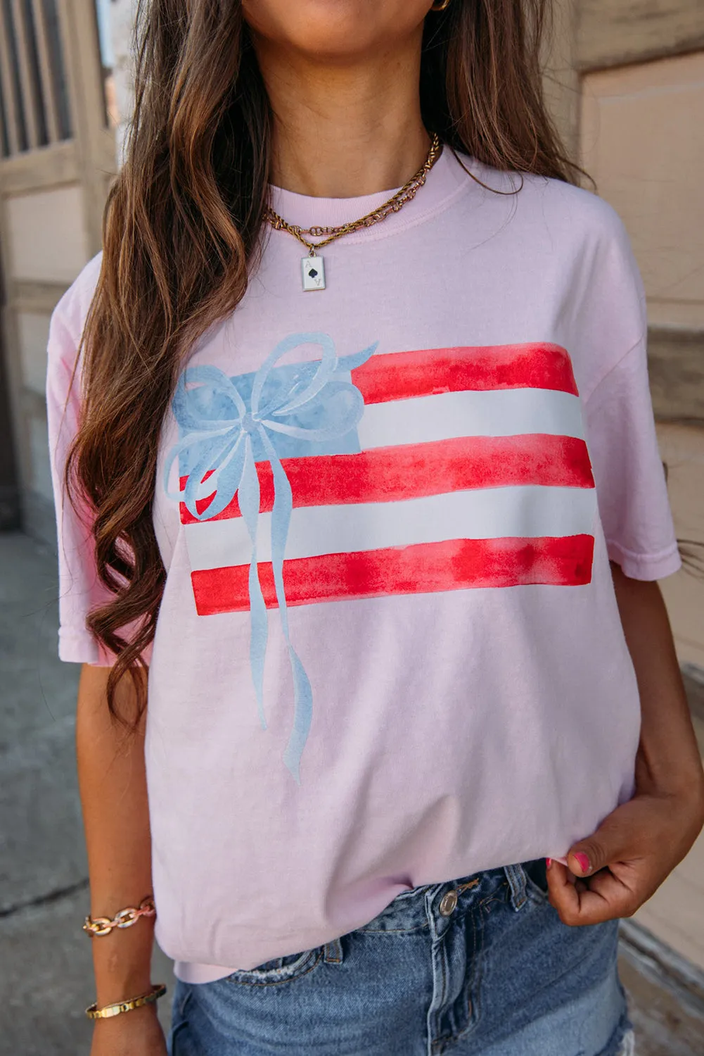 Light Pink Flag Bow Graphic Crewneck Tee sold by Zulily