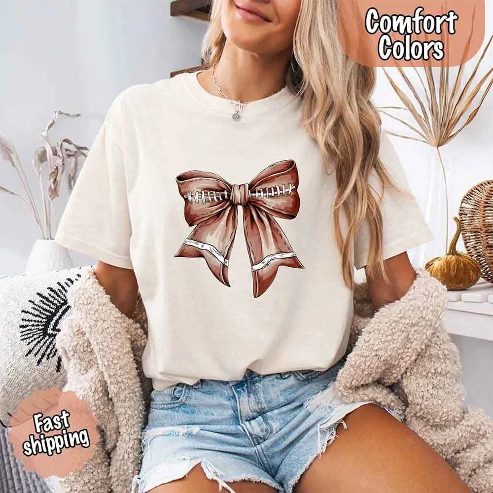 Comfort Colors Vintage Football Bow T-Shirt – Cute Game Day Tee for Women sold by Zulily
