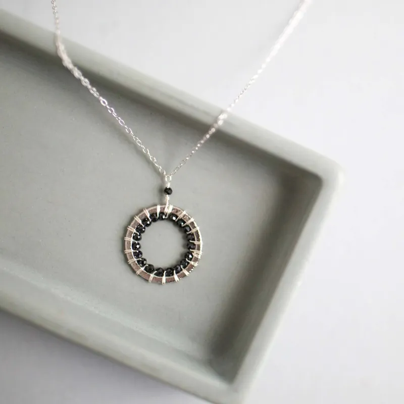 Black Spinel Halo Mini Sliver Pendant made by Zulily