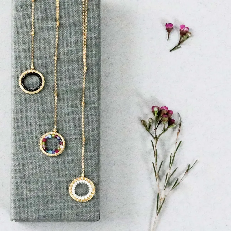 Black Spinel, Rainbow Gemstone and Pearl Halo Y Pendants made by Zulily