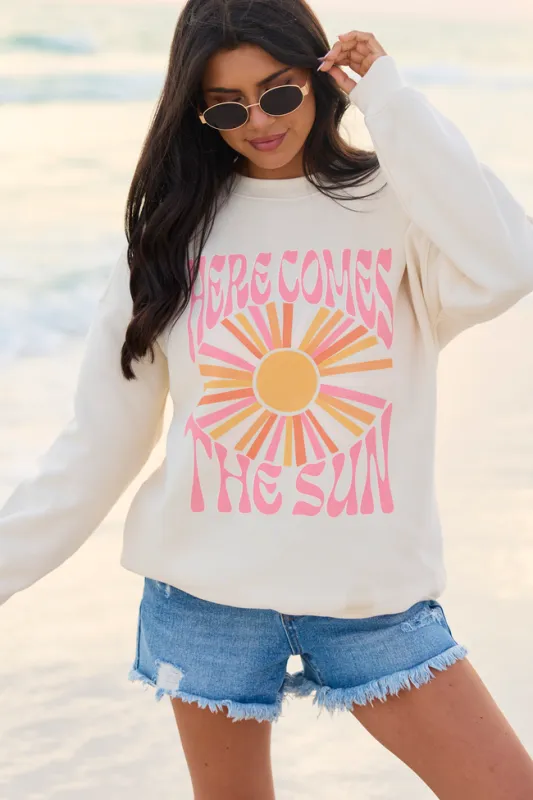 Here Comes The Sun Burst Cream Graphic Sweatshirt made by Pink Lily