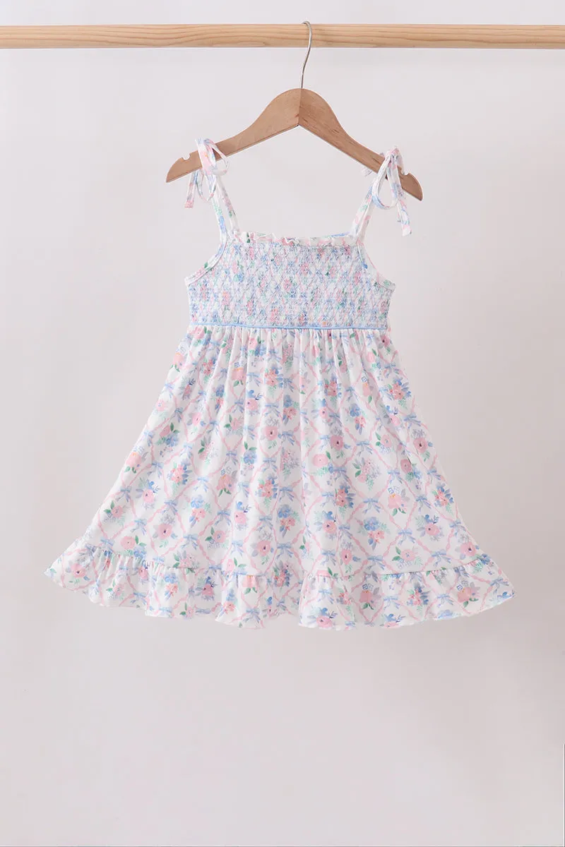 Blue Floral Smocked Ruffle Dress sold by Zulily