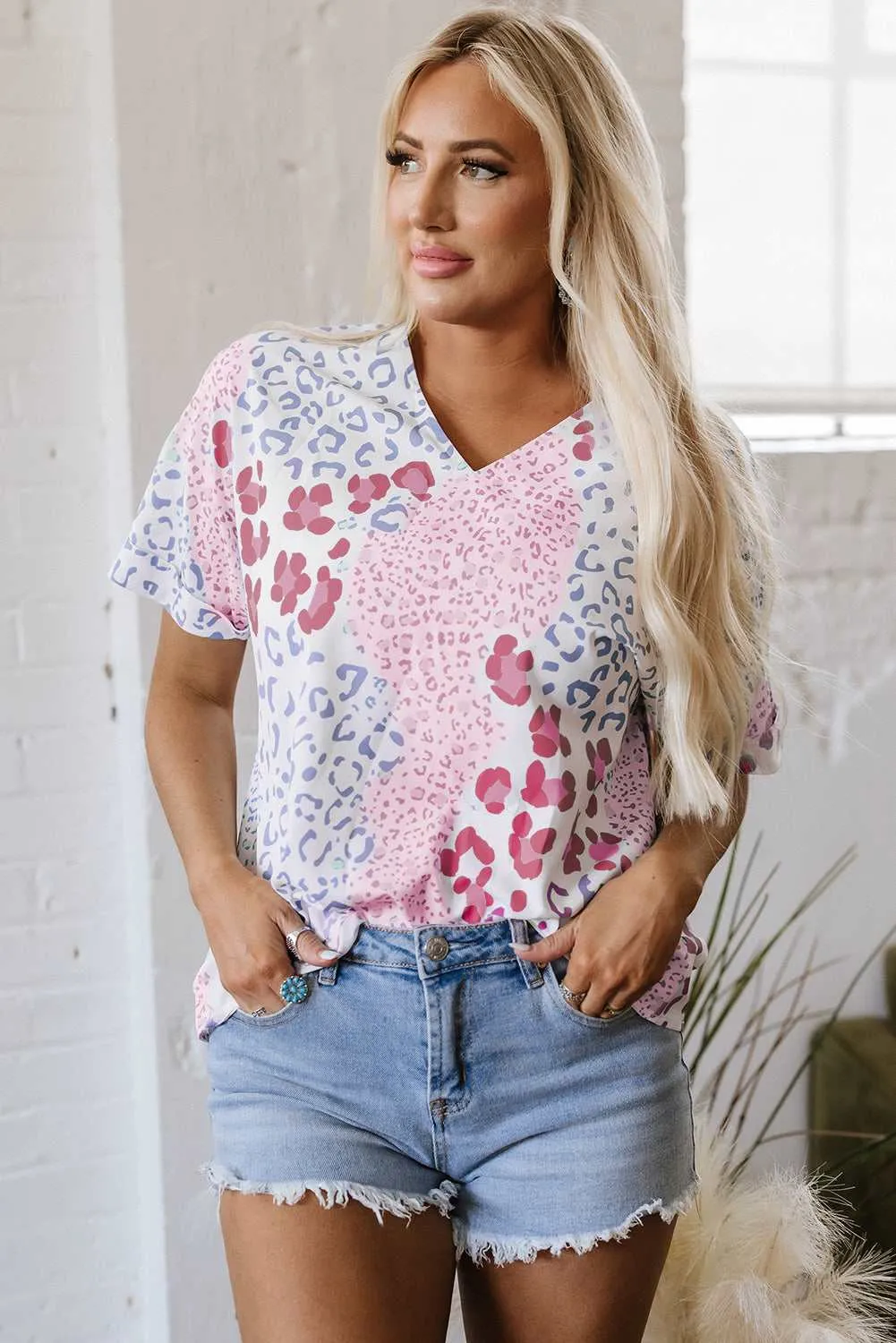 Threaded Pear Luisa Leopard V Neck Short Sleeve Blouse sold by Zulily
