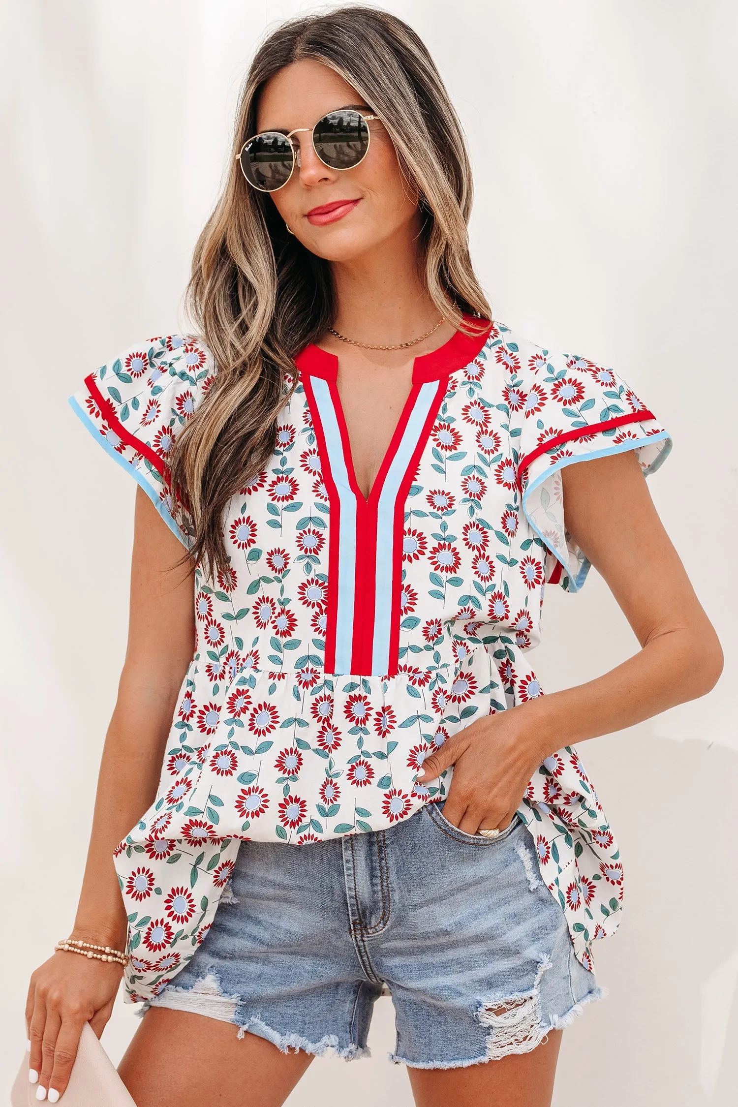 Threaded Pear Avery Trim Flutter Sleeve Blouse sold by Zulily
