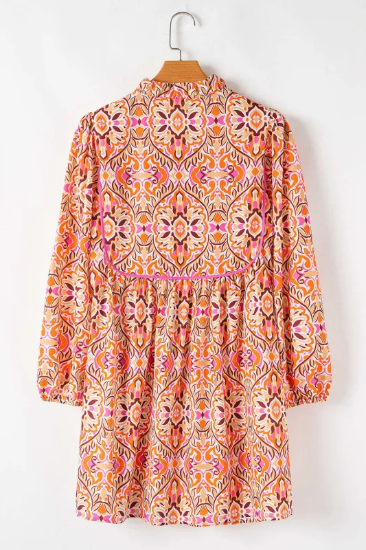 Threaded Pear Aisha Long Sleeve Tied Neckline Mini Dress made by Threaded Pear