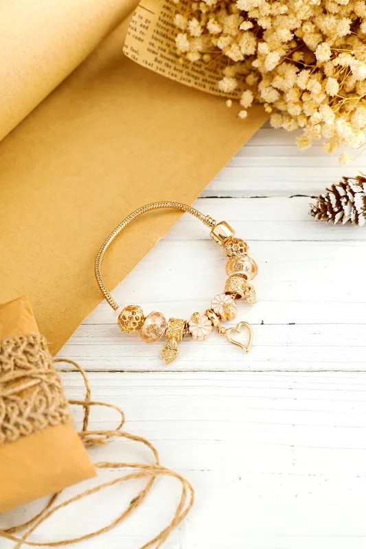 Threaded Pear Gold Flower Heart Charm Plated Alloy Bracelet made by Threaded Pear