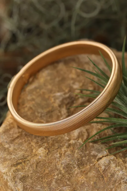 Threaded Pear Stretchy Metal Wide Bangle made by Threaded Pear